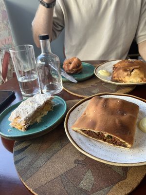 bola de berlim, delícia de ovos, lanche de espinafres e ricotta e lanche de big mac   at A Padoca in Porto