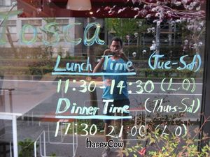Tosca, Kyoto - opening times shown in front window at Tosca in Kyoto