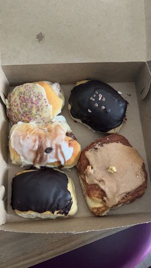 Mardi Gras with cream filing, chocolate glazed with Boston cream, Tiramisu, chocolate glazed, cinnamon roll at Breads on Oak  in New Orleans