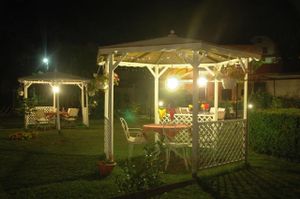 Evening dining in the garden at Le Jardin de Cabrerets at Le Jardin de Cabrerets in Cabrerets