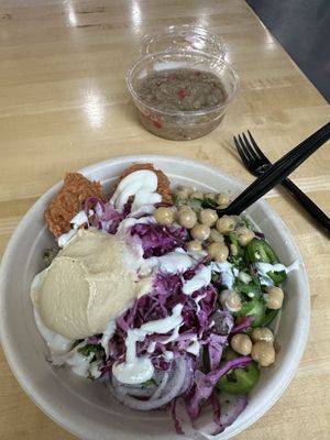 Walnut paste splatter with everything that we love in the vegan world of Arabic food.  side of baba ghanoush  at Nana Middle Eastern Street Food in Tampa