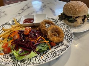Vegan veggie burger (149 baht) with French fries, onion rings and salad (99 baht).  at May Veggie Home Express - ประสานมิตรพลาซ่า in Bangkok