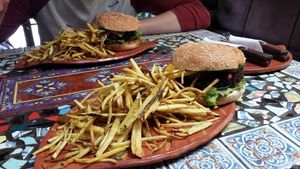 Incredible burgers! reccomend the rosemary lemonade too! sour but delicious! at Sativa Studio Cafe in Banos