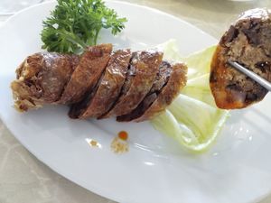 Half eaten spring roll - great! at Mituo Vegetarian Restaurant in Bandar Seri Begawan