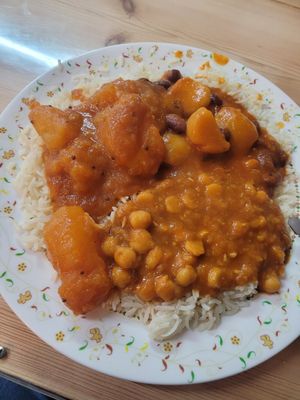 Sunday's three curries (chickpeas, bombay potatoes, and kidney Beans and potatoes) on rice at This & That Cafe in Manchester
