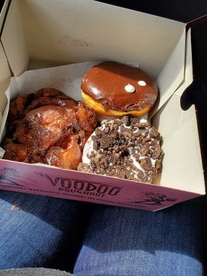 Apple fritter, portland cream (boston cream), & dirt (oreo) at Voodoo Doughnut in Portland