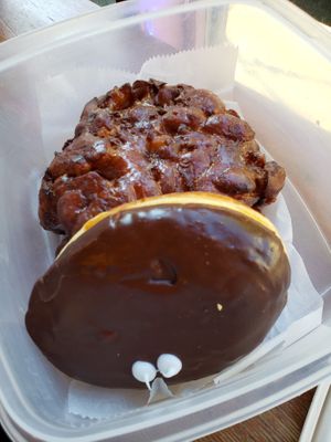 Boston cream and apple fritter. The apple fritter was SUPER good. at Voodoo Doughnut in Portland