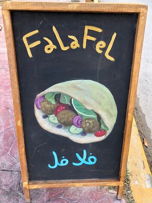 Sign  at Monkey Monkey Falafel in Bacalar