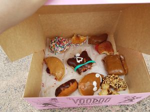 We got the box of a dozen vegan doughnuts and only remembered to take a picture after devouring most of them. at Voodoo Doughnut Tres in Eugene
