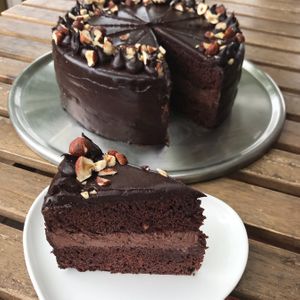 Chocolate mousse Center with dark chocolate ganache & hazelnut sprinkle at Loving Hut Perth in Wembley