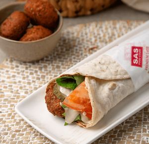 Falafel wrap: flatbread, peas, parsley, coriander seeds, black pepper, onion, garlic, hot peppers, optional: cabbage or lettuce, tomatoes, tahini, pickled cucumber at SAS Food Court in Yerevan