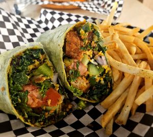 Veggie packed crispy chicken wrap. at rooted AF in Wilmington