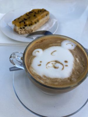 Cappuccino with soya milk and a dessert  at La Compañía in Santiago