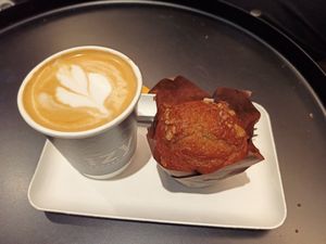 White latte and muffin at IzyCoffee  in Leuven