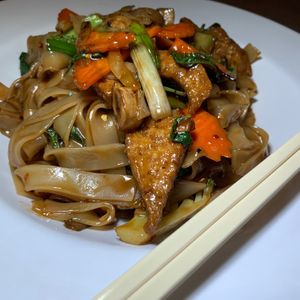 Drunken Noodle (Pad Kee Mao): Stir-Fried Rice Noodles, Tofu, Onions, Mushrooms, Carrots, Broccoli, Basil Leaves in Soy Sauce & Housemade Chili Paste at Lai Thai Kitchen in Grand Rapids