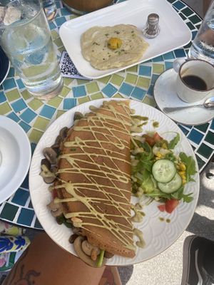 Stuffed omelette and a side of a fried egg  at Café Naiv in Innsbruck