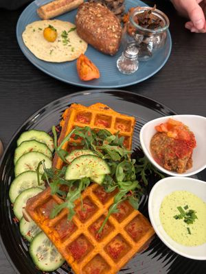 Savory waffles & English breakfast platter at Café Naiv in Innsbruck