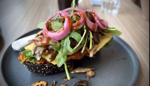 Just Brekkie: activated charcoal sourdough slice, roasted red pepper spread. Just Egg. organic mushrooms, tomatoes, greens, hot sauce 🤤😋
  at Feast & Fallow in Vancouver