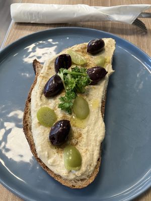 Olive and hummus toast   at Feast & Fallow in Vancouver