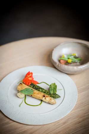Asparagus cooked in 2 ways, nuts praliné and nasturtiums -  VEGAN plate , plant-based gastronomy  at Entropy in Brussels