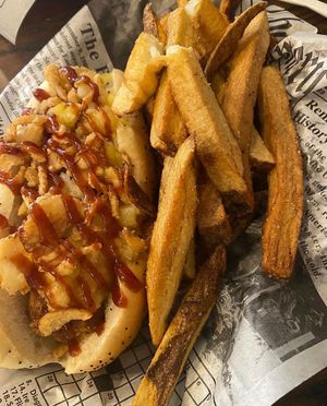 vegan hot dog with pineapple, crispy onions and bbq sauce with boardwalk fries. at Old Dominion Doggery & Burger in Strasburg
