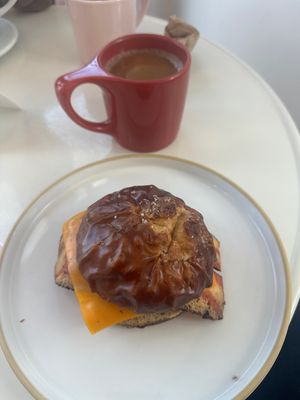 Egg and Cheese on pretzel Brioche Bun and an Americano with Oat Milk!  at Little Loaf Bakeshop in New Paltz