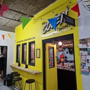 Indoor and shop front seating at THE COVEN of WICHES in East London