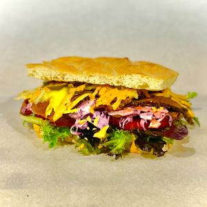 "THE BEEV v2"
BEEV, CHEESE, JALAPENOS, SALAD, TOMATO, SWEET PEPPERS, CHIPOTLE CREMA, RED CABBAGE SLAW. at THE COVEN of WICHES in East London