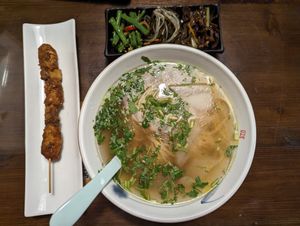 I ordered the Japanese noodle set meal which included a bowl of noodles, a mock meat skewer, three vegetable sides, and a mock pan fried egg (not pictured). Everything was truly de at Baiyi Vegetables Lanzhou Sulamian - 百易素食·素拉面（元大都店) in Beijing