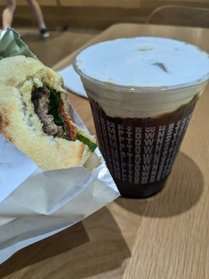 Vegan breakfast sandwich and Coraline's coconut cream cold brew. at Stumptown Coffee Roasters - Downtown in Portland