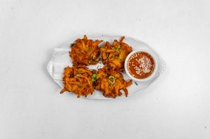 Onion Bhaji:
Pieces of fried onion, wrapped in chickpea flour batter. at Tandoor King Indian Restaurant in Karlovy Vary