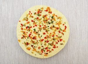 Masala Papadum:
Thin crispy slices of lentil flour with red onion, chili, and coriander. at Tandoor King Indian Restaurant in Karlovy Vary
