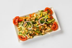 Chickpea Salad:
Vegetable salad with chickpeas, coriander, and ginger in a lemon dressing. at Tandoor King Indian Restaurant in Karlovy Vary