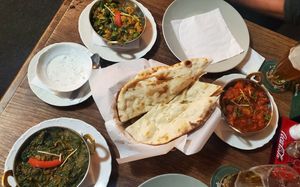 Naan with all the plates at Tandoor King Indian Restaurant in Karlovy Vary