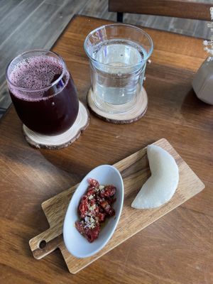 chicha morada, sparking water, and pita with sun dried tomatoes  at Boochmania in San Francisco