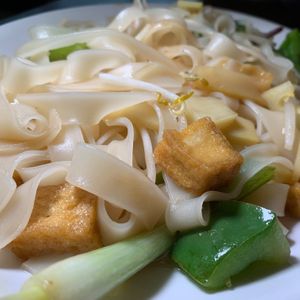 Drunken Noodles (Pad Khi Mao): Stir-Fried Wide Noodles, Thai Basil, Onions, Bean Sprouts, Bamboo Shoots & Green Peppers. (You must specify VEGAN to omit the Egg.) at Bangkok Taste Cuisine in Grand Rapids