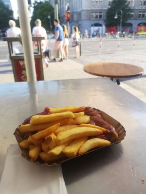 Churrywurst with fries at WITTY'S Bio Currywurst am Wittenbergplatz - Kiosk in Berlin