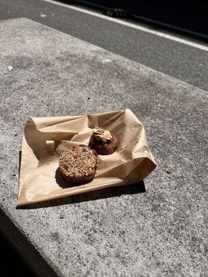 Oat/seed “muffin” and peanut butter chocolate bite.  at Syra Coffee in Barcelona