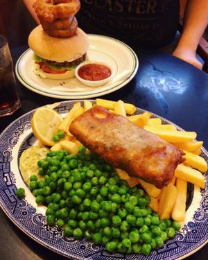 Yummy vegan fish 'n chips and a veggie burger. at Norman's Coach and Horses in London