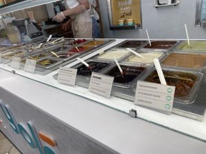 Toppings showing vegan labels (not all are vegan)  at Yolé in London