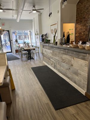 Bright and cozy space with tables and booths    at The Green Bar in Hamilton
