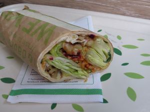 hand-rolled wrap "Oriental Vegan" with bulgur, cucumber, beetroot, rocket leaves, walnuts, mint, lettuce, and sweet mustard sauce at Dean & David - St Johanner Markt in Saarbrucken