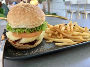 Burger (with pineapple) and fries   at nomVnom Cafe in Johor Bahru