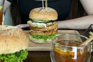 Double chicken burger with double fried vegan eggs  at nomVnom Cafe in Johor Bahru