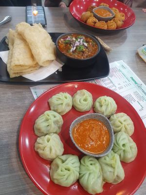 Steamed momos, soft naan and pea curry, deep fried momos at Momo Central - Bourke St in Melbourne