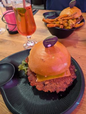Simply Vegan Burger and Hot Vegan Burger, both regular, sweet potatoes, homemade ice tea raspberry and coke at Smashup! in Aachen