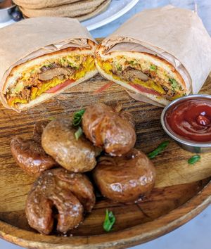 Steak and egg breakfast wrap with pressed potatoes at Cafe Gratitude in Venice