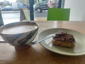 Peanut butter, date and chocolate flapjack with oat milk cappuccino at Garden Kitchen in Sheffield