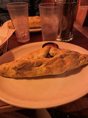 pod with spinach dough, vegan cheese, mushrooms, carrots, black olives  at Pizza Plant in Williamsville