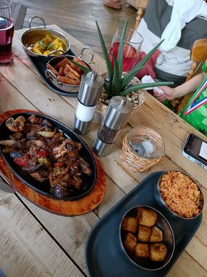 Some of the sharing platter for 2: aubergine and mushrooms in a peanut sauce, Malay curry (with tofu on my request - adapted from their menu), chips, jollof rice and fried plantain at Cape To Cairo in Shildon